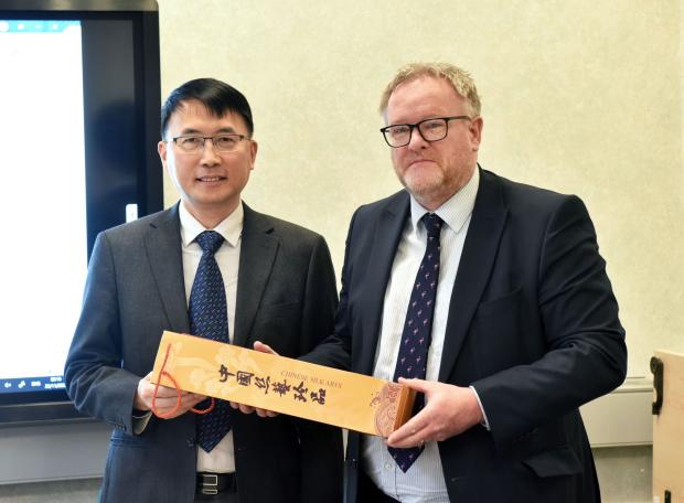 Dr Zhihui Zhao with Dr Alastair Douglas, Director of AFBI Veterinary Sciences Division Dr Zhihui Zhao with Dr Alastair Douglas, Director of AFBI Veterinary Sciences Division