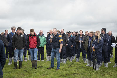 Harold Johnston with his sons Jack and Steven speaking at the GrassCheck Dairy Farm Walk on his farm