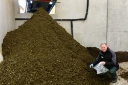Dr Gary Lyons collecting a sample of separated slurry solids