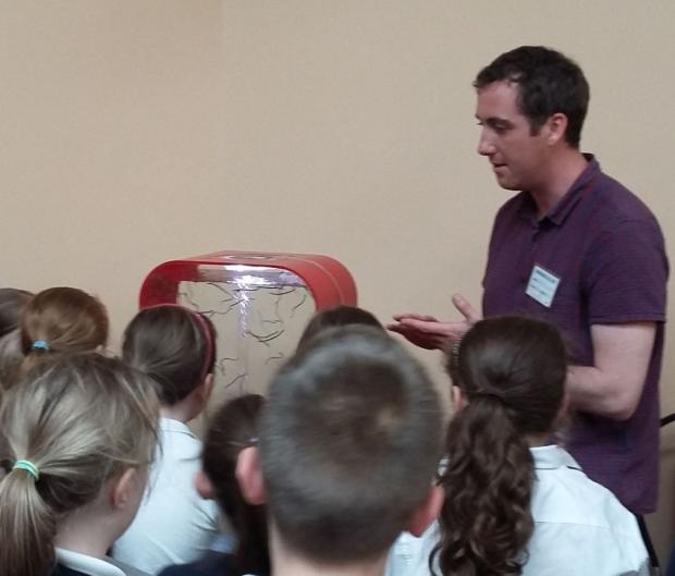 Pupils from Creggan Primary School and St Oliver Plunkett’s Primary School are shown elvers by Conor Dolan from AFBI as part of the Toome Eel Fisheries School Day