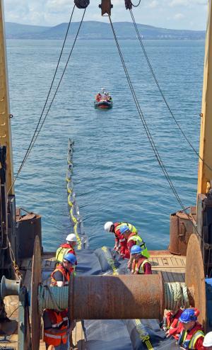 The 200m conventional boom being deployed from RV Corystes during the exercise, with AFBI's inshore RIB (Rigid Inflatable Boat) in the background acting as safety boat 