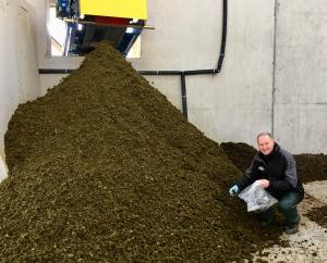 Dr Gary Lyons collecting a sample of separated slurry solids