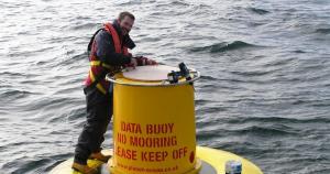 Dr Adam Mellor (AFBI) on a research buoy